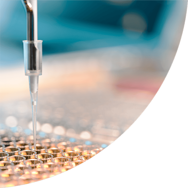 Close up view of a pipetting robot in a laboratory setting being used for medical studies.